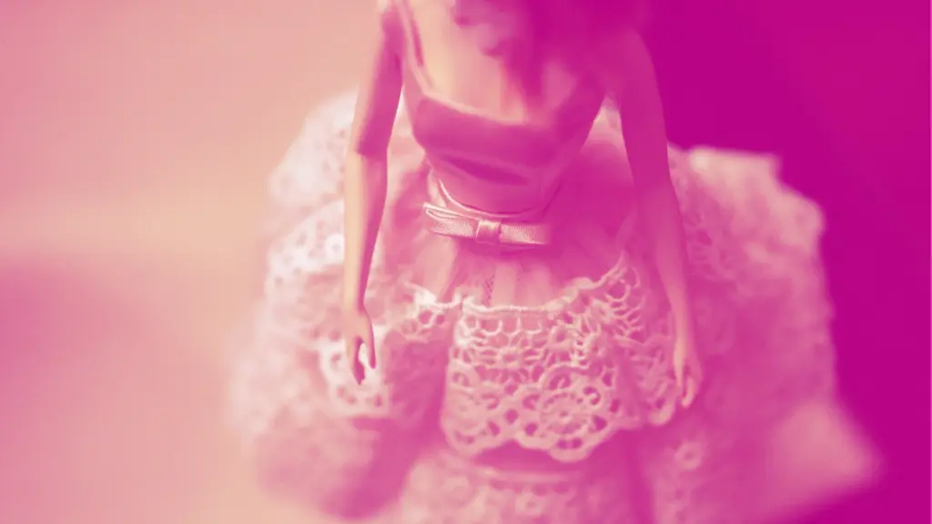 Pink-hued Barbie doll wearing prom dress
