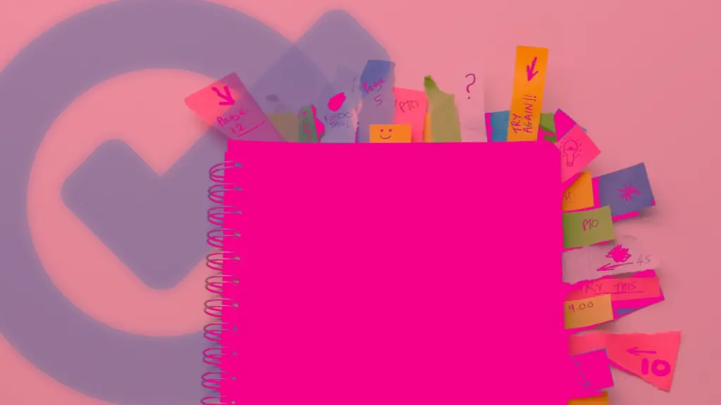 A pink spiral notebook with many sticky notes coming out of it on a pale pink background and task checkmark symbol