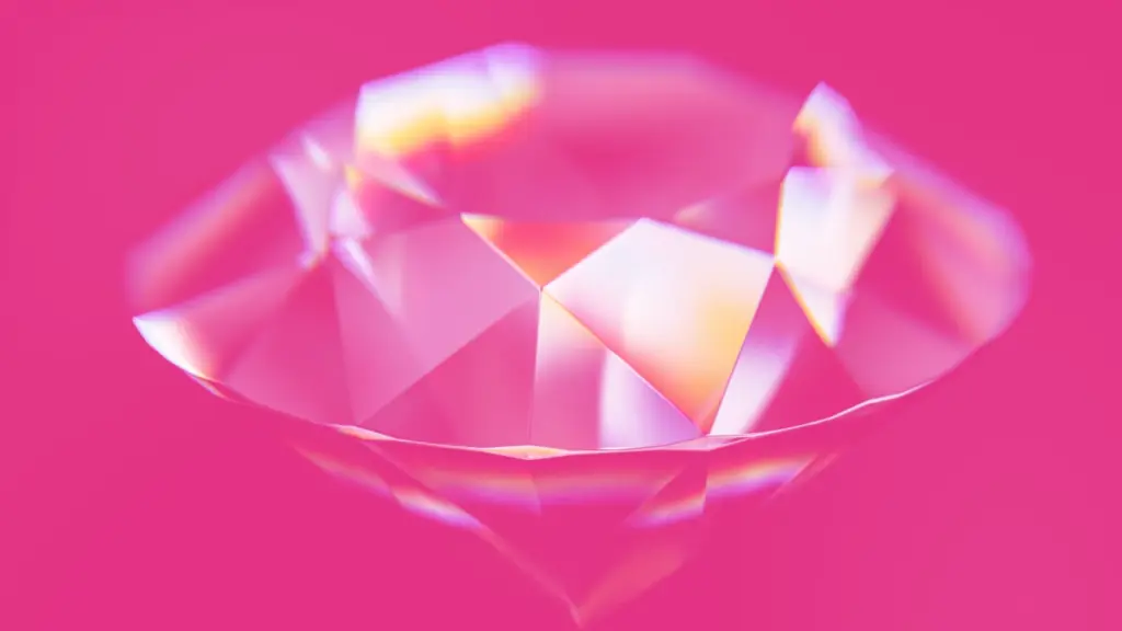 A cut gemstone on pink background